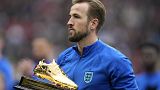England's Harry Kane receives a trophy for the highest goalscorer of England at Wembley Stadium in London, Sunday, March 26, 2023.