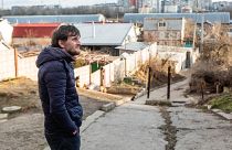 Kherson resident Roman stands in his neighbourhood in Kherson, Ukraine, 2023. Here he has been living with his family through Russian occupation of the city