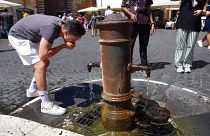 Tourist refreshes at a fountain in Rome, Italy, on 19 August, 2023.