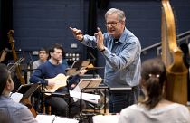 British composer Sir John Eliot Gardiner conducts the orchestra during a rehearsal session at Sadler's Wells Theatre in London.