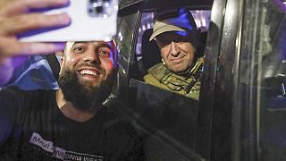 Yevgeny Prigozhin, the owner of the Wagner Group military company, right, sits inside a military vehicle posing for a selfie in Rostov-on-Don, Russia, Saturday, June 24, 2023.