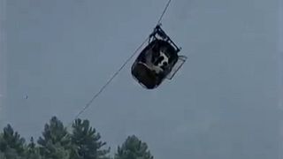A cable car carrying six children and two adults dangles hundreds of meters above the ground in the remote Battagram district, Khyber Pakhtunkhhwa, Pakistan on 22, Aug, 2023 