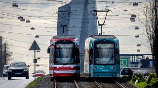 Trams are pictured near the European Central Bank in Frankfurt, Germany.